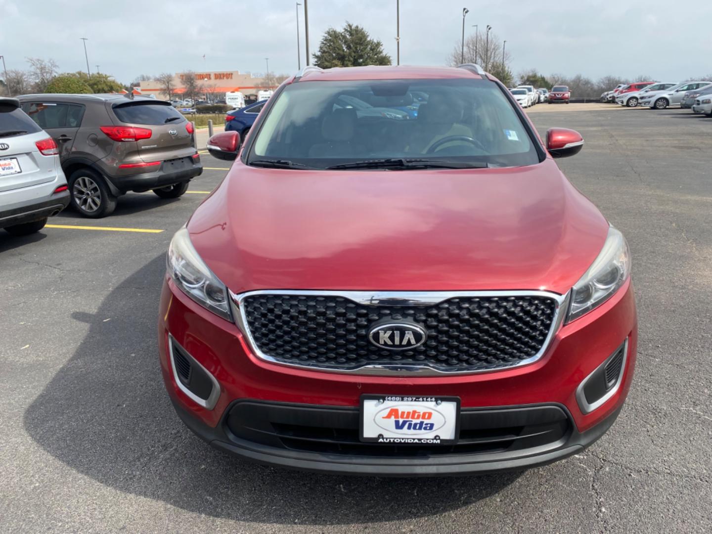 2016 RED Kia Sorento LX 2WD (5XYPG4A32GG) with an 2.4L L4 DOHC 16V engine, 6-Speed Automatic transmission, located at 420 I-35E, Lancaster, TX, 75146, (469) 297-4144, 32.593929, -96.823685 - Photo#2